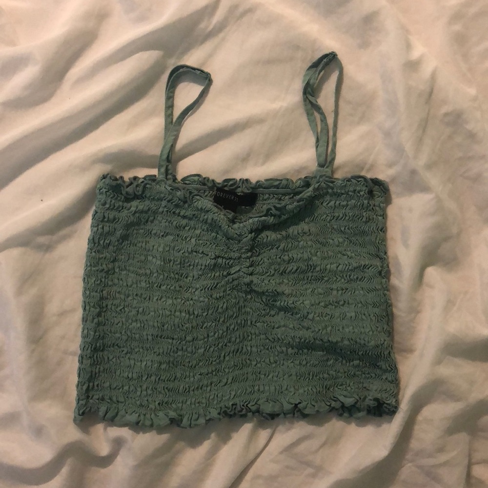 Teal tight ruffled crop top.